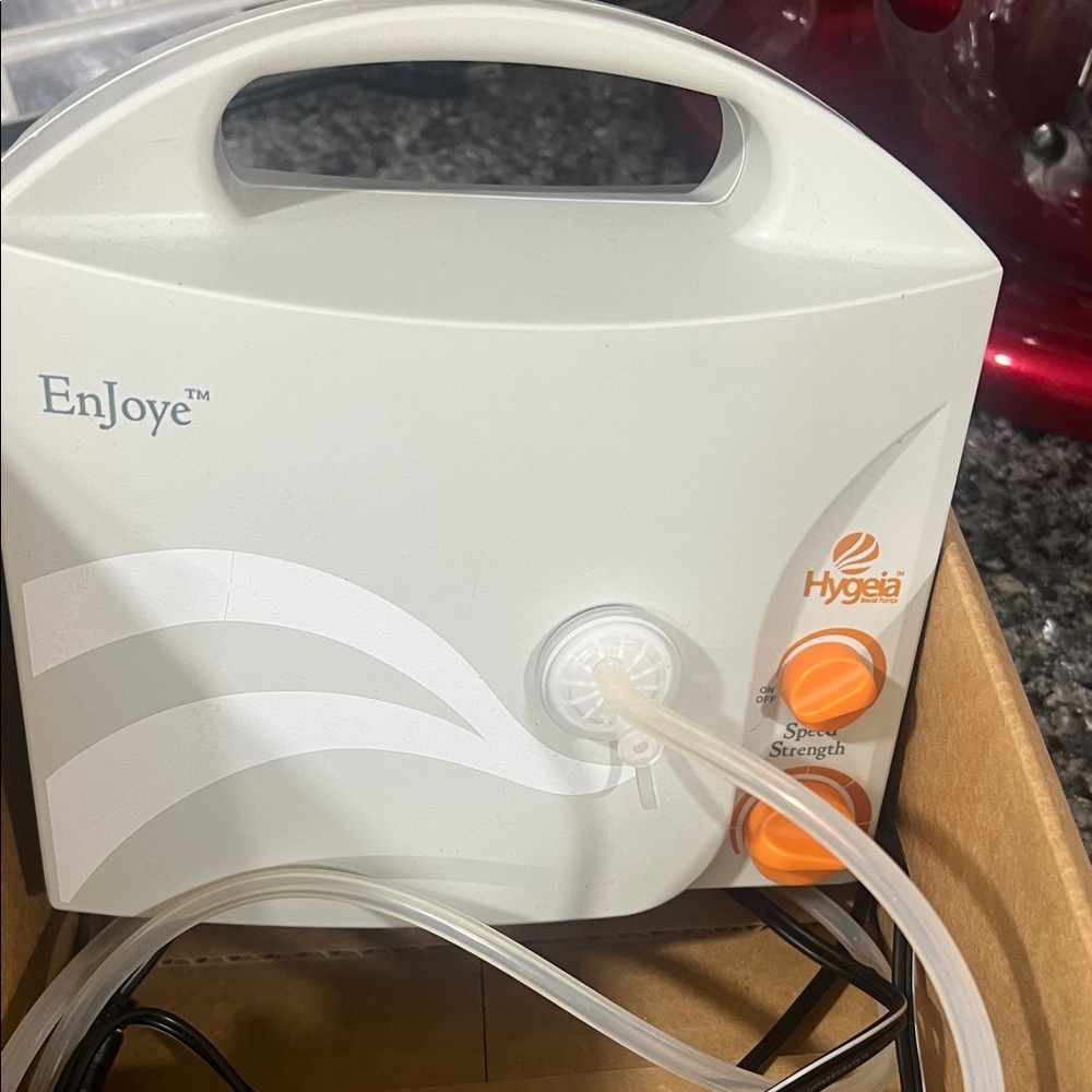 Hygeia EnJoye Breast Pump with Orange Accents